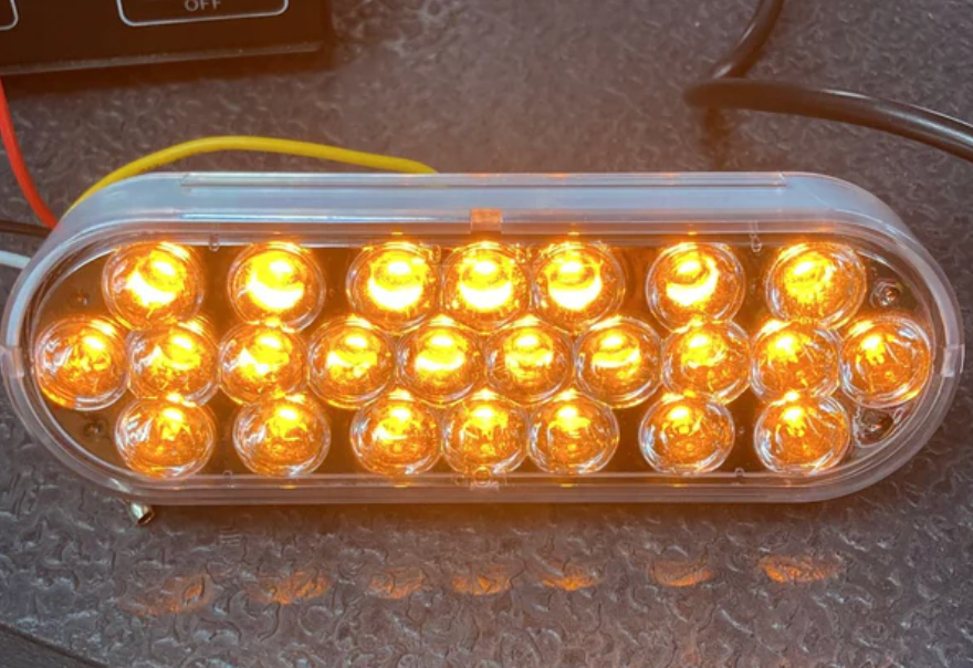 6" Oval Led Light Dual Amber/Blue Clear Lens 12/24V