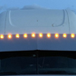 Visor 18" Freightliner Cascadia Condo / Mid Roof. Custom w/ (10) 2" light cut out Across the Top Evenly Spaced.