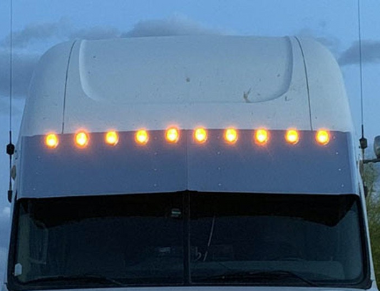 Visor 18" Freightliner Cascadia Condo / Mid Roof. Custom w/ (10) 2" light cut out Across the Top Evenly Spaced.